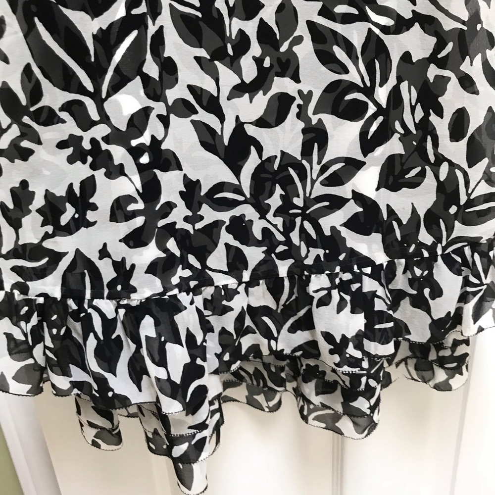 Women’s tiered black and white party dress.